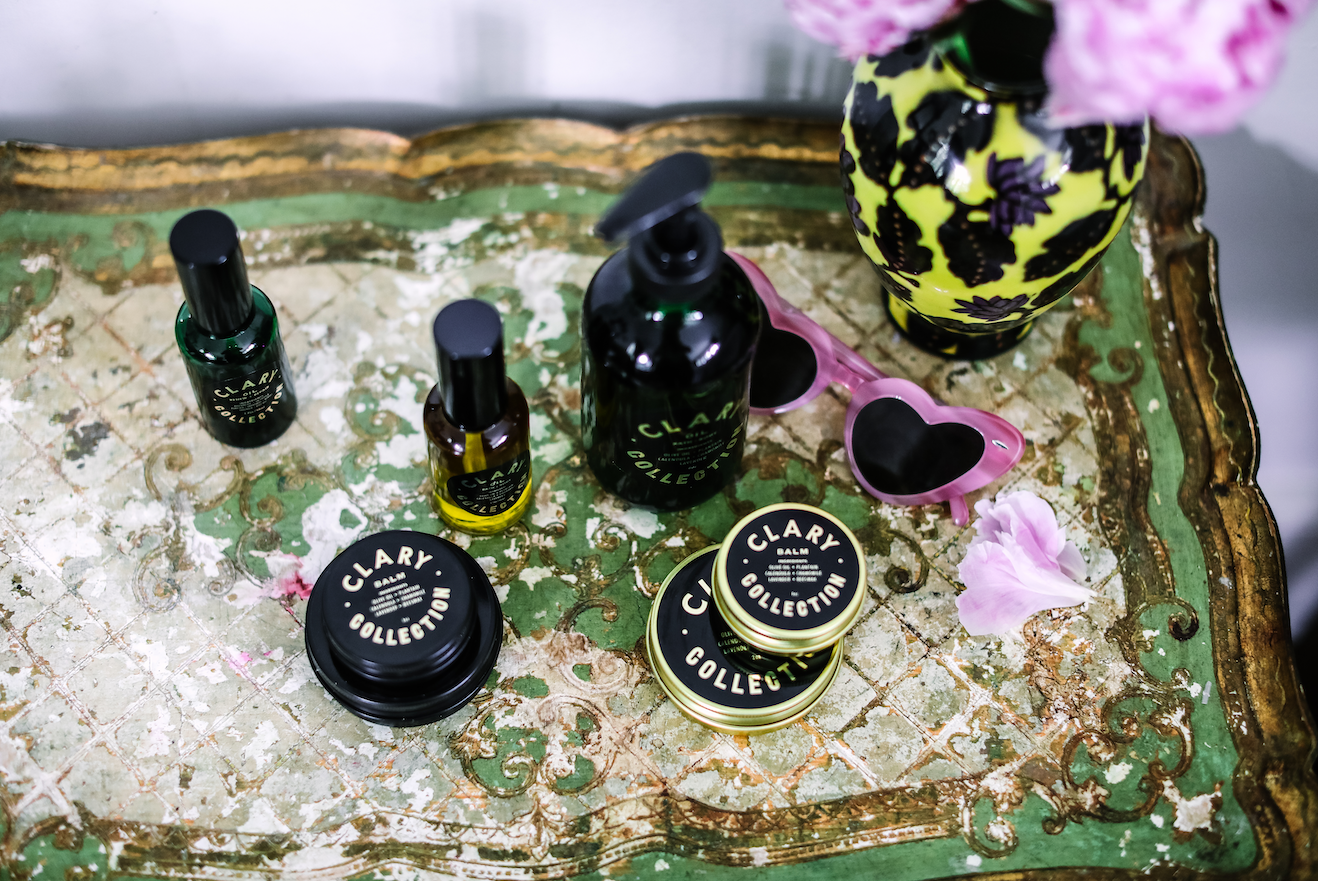 Clary All-Purpose Balm, Bath and Body Oil, and Face Serum on Side Table